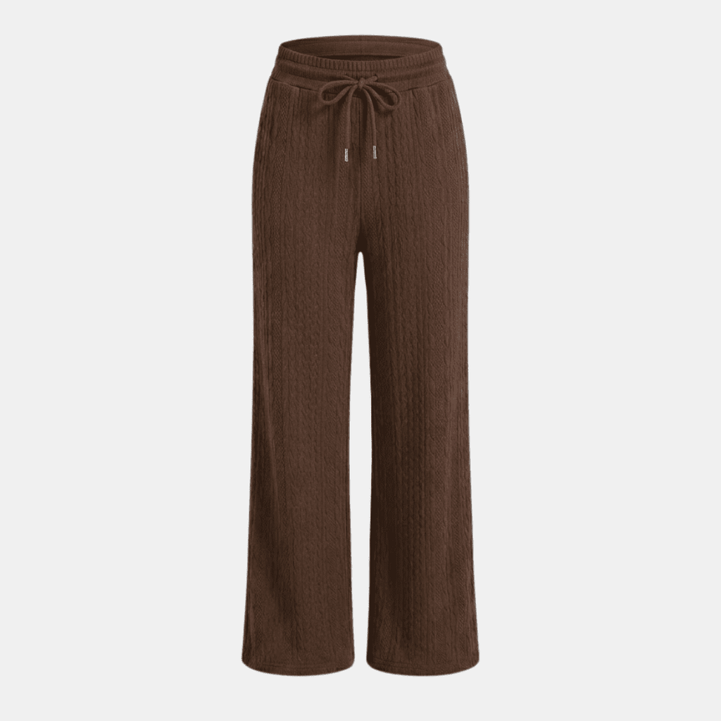 Women's cable-knit wide-leg lounge trousers by Tammy Bradley, showing cozy knit fabric and relaxed fit in neutral color.