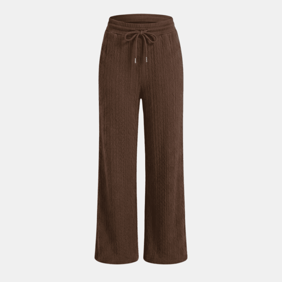 Women's cable-knit wide-leg lounge trousers by Tammy Bradley, showing cozy knit fabric and relaxed fit in neutral color.