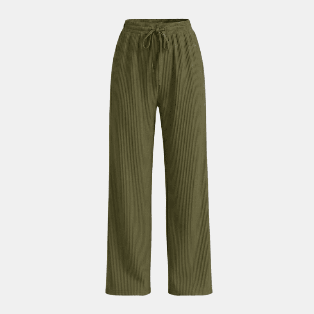 Women's plissé wide-leg trousers by Tammy Bradley, featuring flowing fabric and a relaxed fit, shown in a stylish pants silhouette.