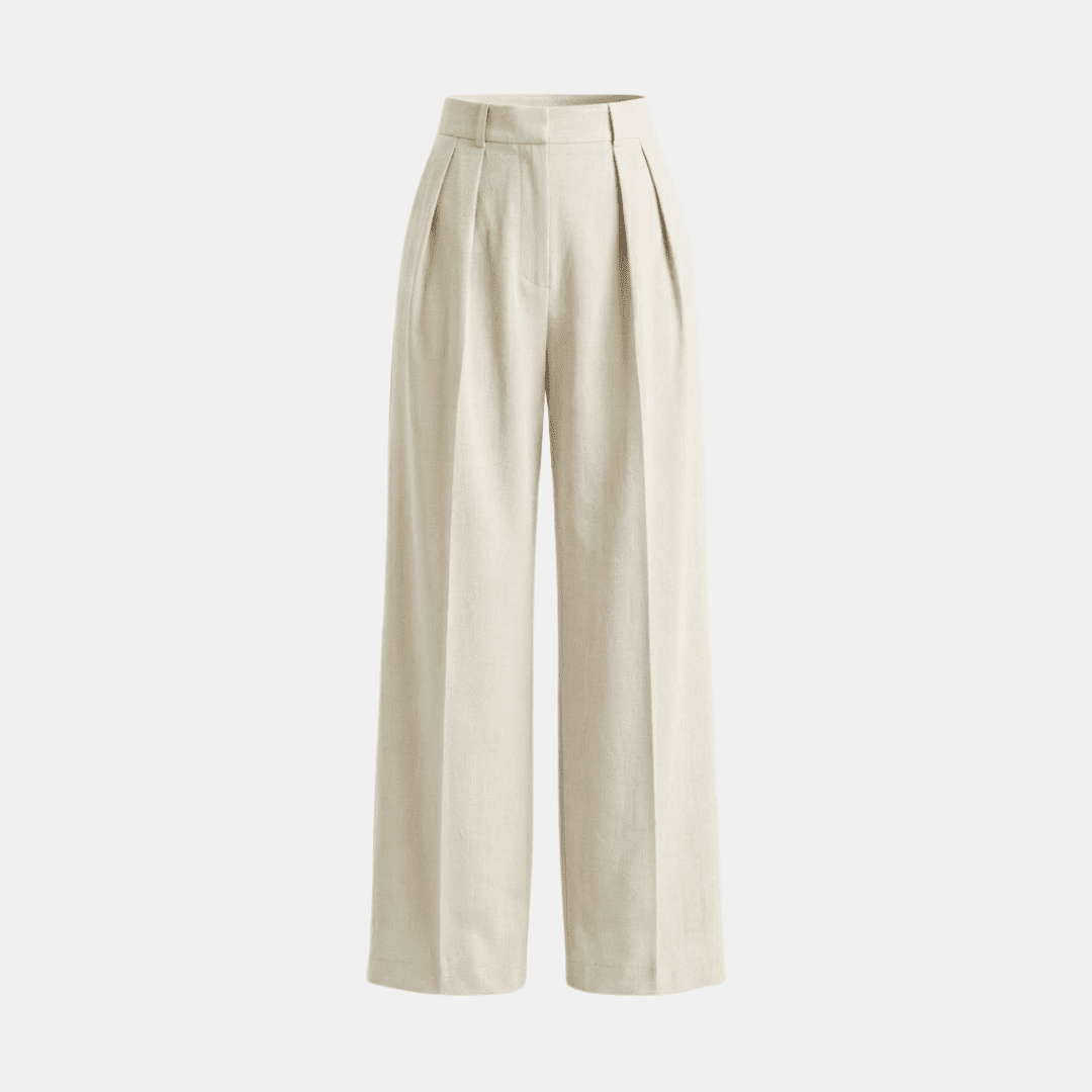 White high-waisted pleated wide-leg trousers for women by Tammy Bradley, showing the relaxed fit and stylish design.