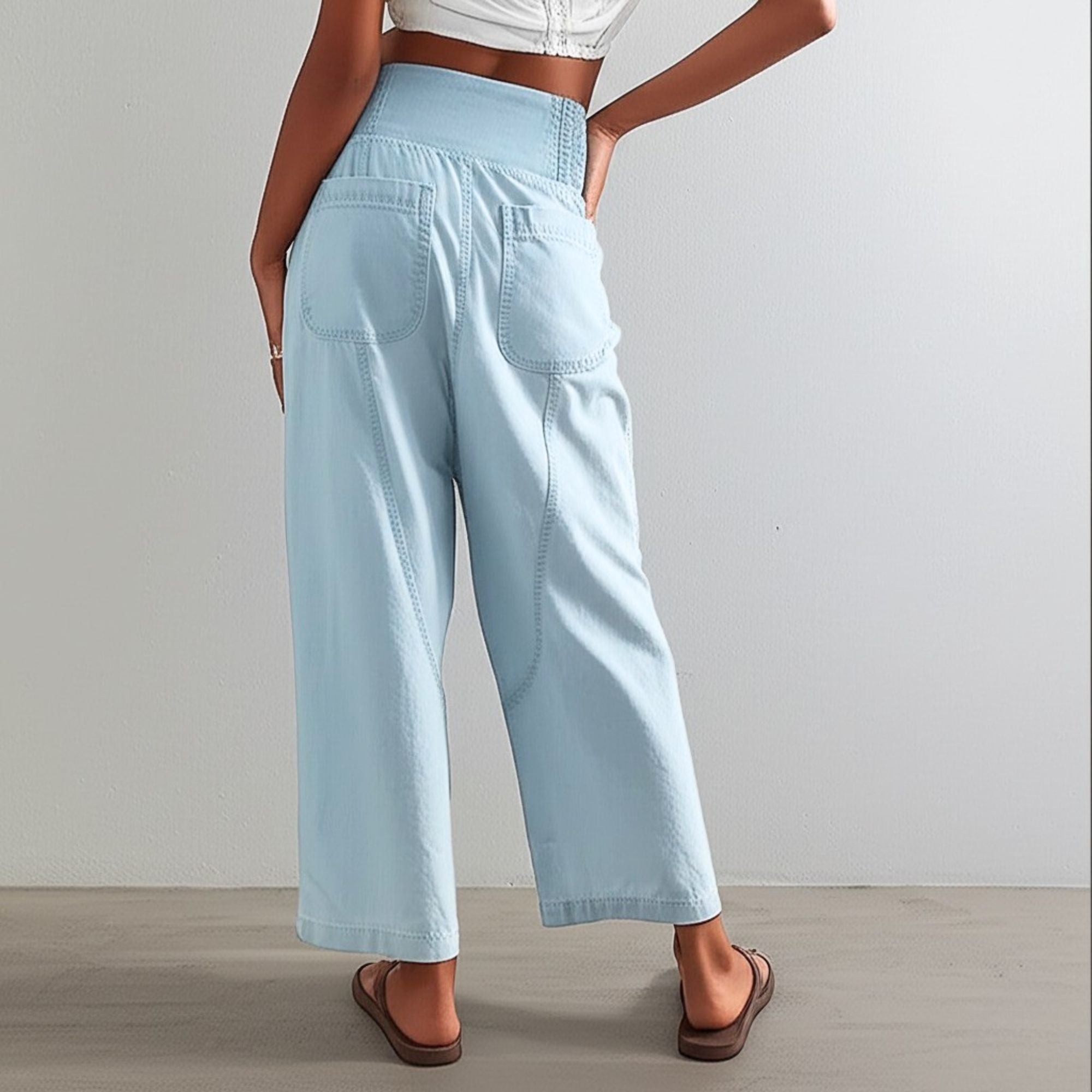 Women’s harem-cut wide-leg denim trousers with a loose, pull-on style, featuring a relaxed fit and casual denim fabric.
