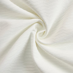 Cream textured lantern sleeve two-piece set for women featuring stylish pants, displayed on a model showcasing the fashionable outfit.