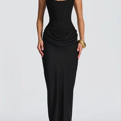 Summer maxi dress for women with square neckline and bodycon fit, stylishly displayed on a model in a summery setting.