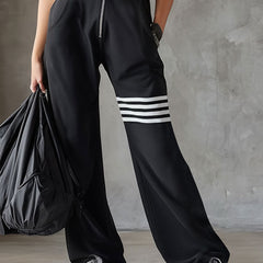 Black striped sleeveless hooded jumpsuit for women, featuring pants style and casual fit, shown on a model.
