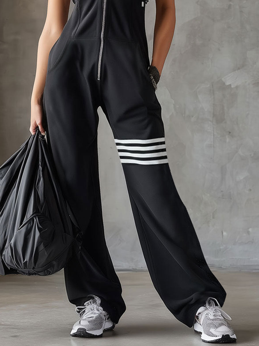 Black striped sleeveless hooded jumpsuit for women, featuring pants style and casual fit, shown on a model.