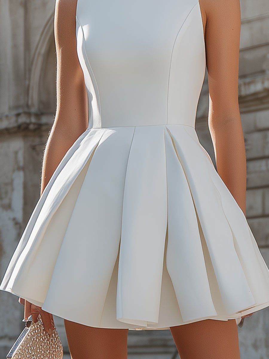 Tammy Bradley sleeveless structured pleated mini dress for women, showcasing a fitted bodice and stylish pleated skirt.