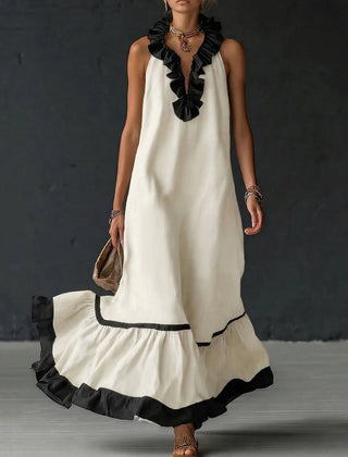 A-line maxi dress with contrast colors, pleated ruffle trim, split joint, and V-neck design, featuring a loose fit and elegant style.