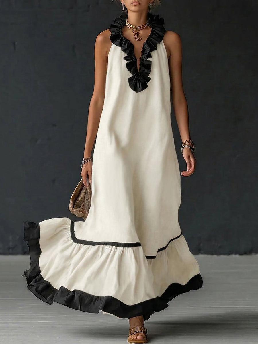 A-line maxi dress with contrast colors, pleated ruffle trim, split joint, and V-neck design, featuring a loose fit and elegant style.