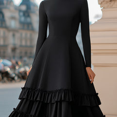 Black high-neck A-line tiered ruffle midi dress by My Store, showcasing the elegant design and flowing fabric.