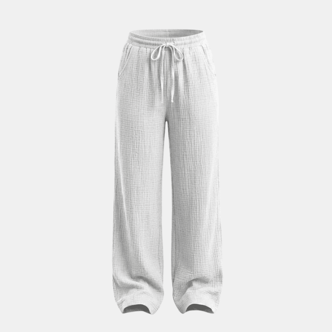 Women’s cotton wide-leg trousers by Tammy Bradley, featuring a relaxed fit and waistband, shown on a model against a neutral background.