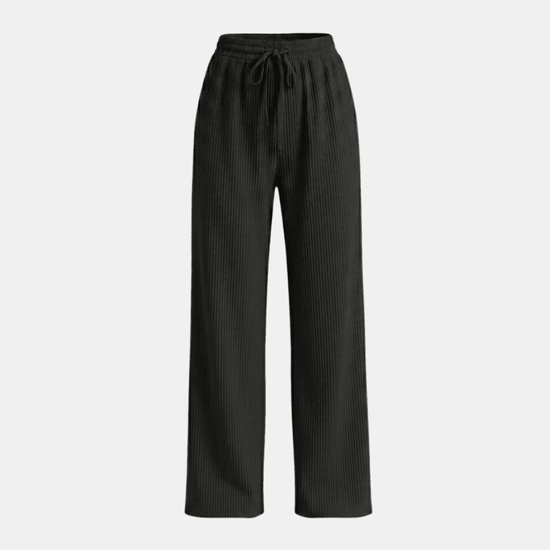 Women's Tammy Bradley plissé wide-leg trousers with flowing fabric and high waist, shown on a model.
