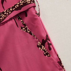 Rose red leopard print chiffon long sleeve jumpsuit for women, featuring stylish pants and a flowing design.