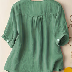 Light beige V-neck linen summer blouse for women, featuring a flowy and casual design, perfect for warm weather.