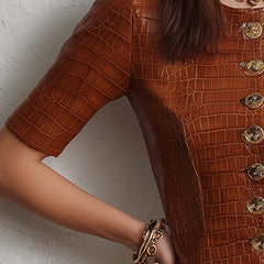 Caramel croc-embossed faux leather midi dress with long sleeves and a fitted silhouette, featuring a stylish and textured design.
