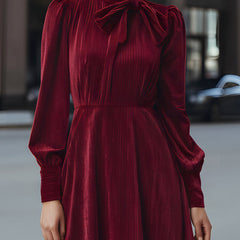 Burgundy velvet pleated midi dress with bow-neck detail, elegant cocktail dress by My Store, featuring a flattering fit and sophisticated style.