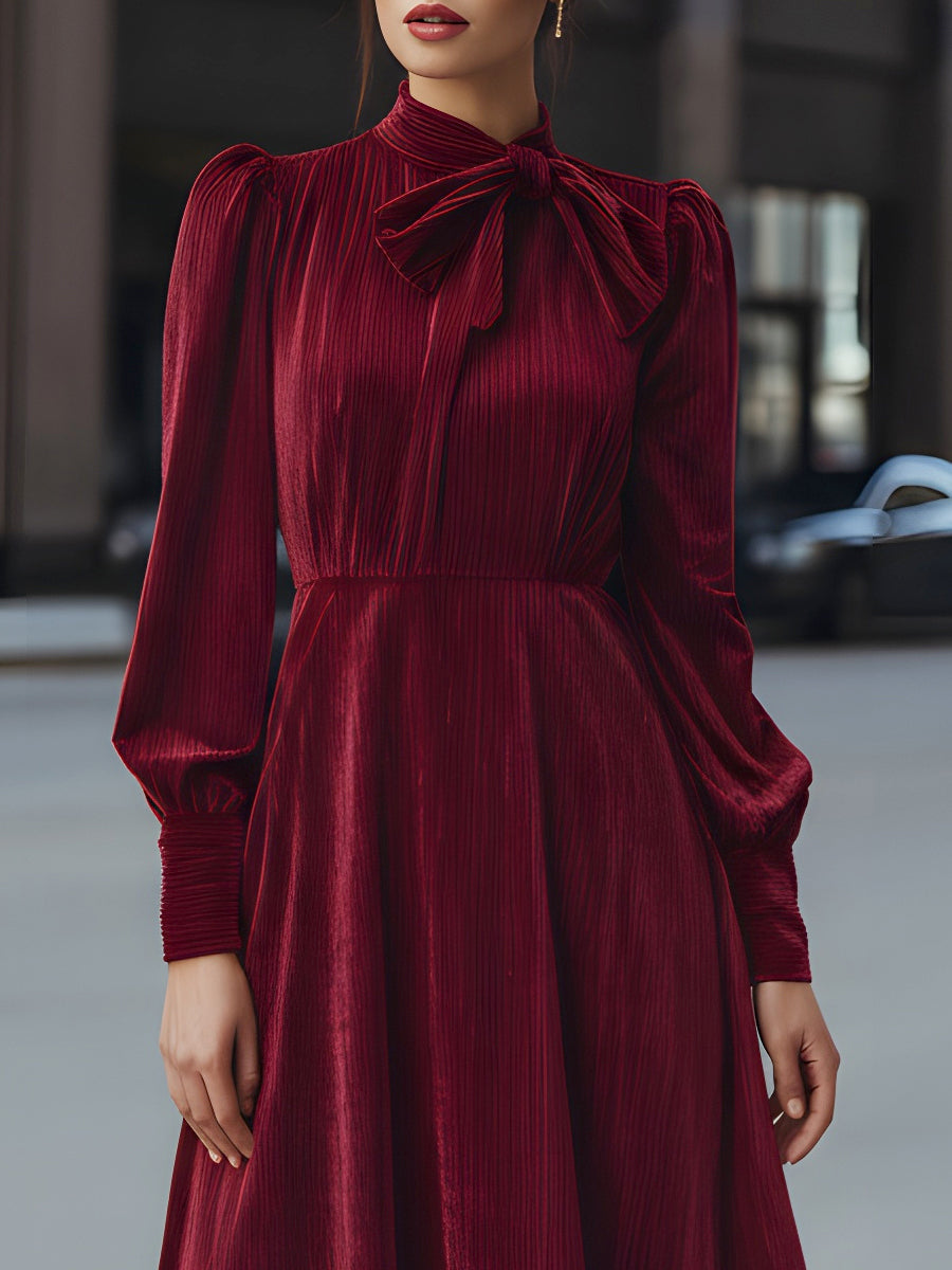 Burgundy velvet pleated midi dress with bow-neck detail, elegant cocktail dress by My Store, featuring a flattering fit and sophisticated style.
