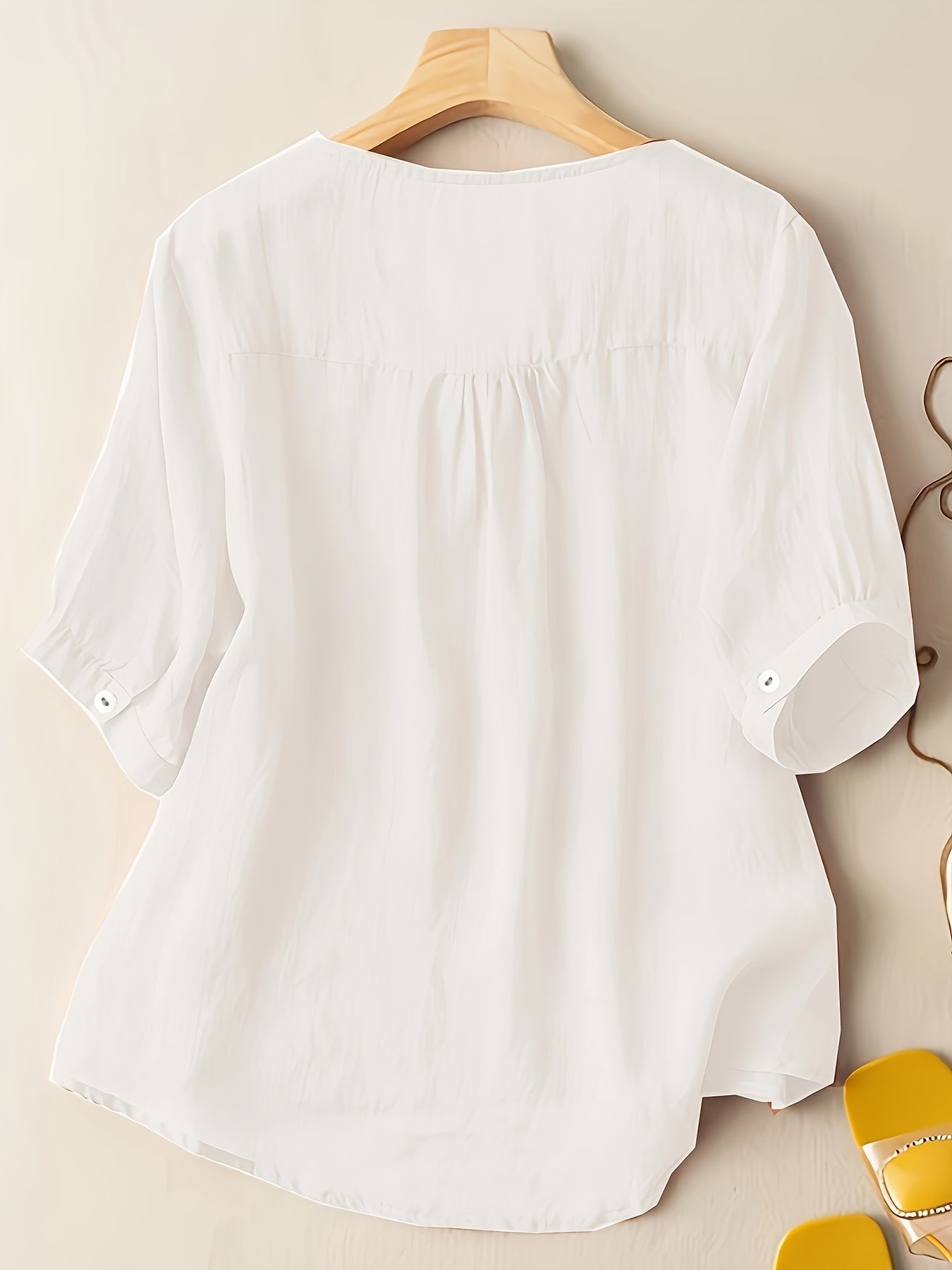 Light beige V-neck linen summer blouse for women, flowy and casual, perfect for warm weather and relaxed style.