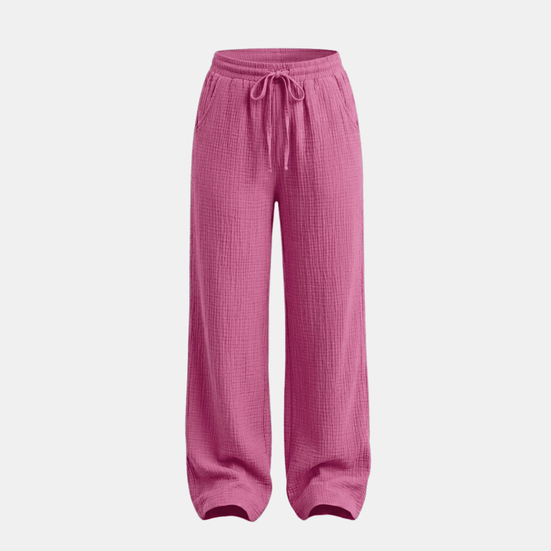 Women's cotton wide-leg trousers by Tammy Bradley, showing relaxed fit and comfortable style in soft white fabric.