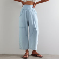 Women's pink harem-cut denim jeans by My Store featuring a sculpted design and relaxed fit, displayed on a model.