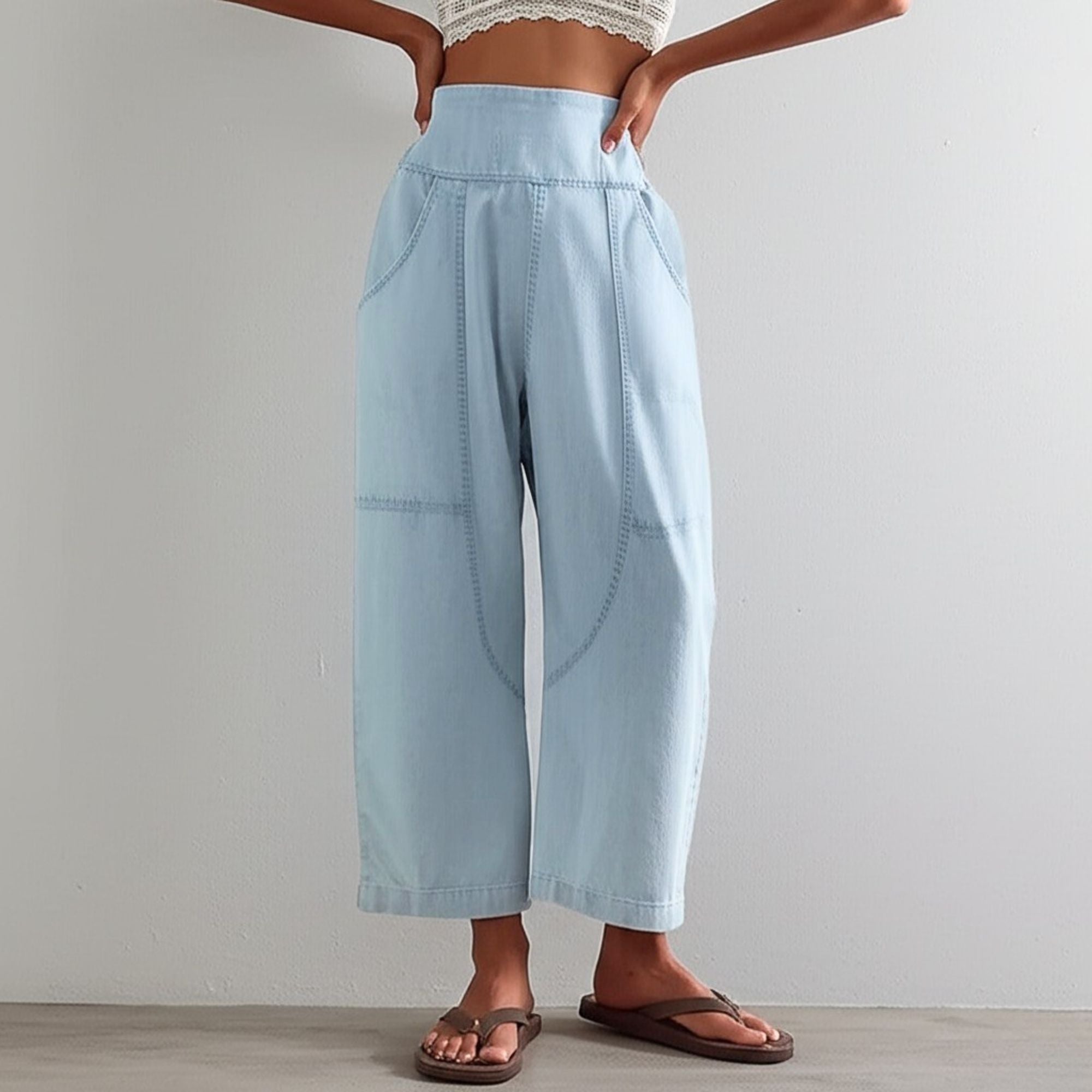 Women's pink harem-cut denim jeans by My Store featuring a sculpted design and relaxed fit, displayed on a model.