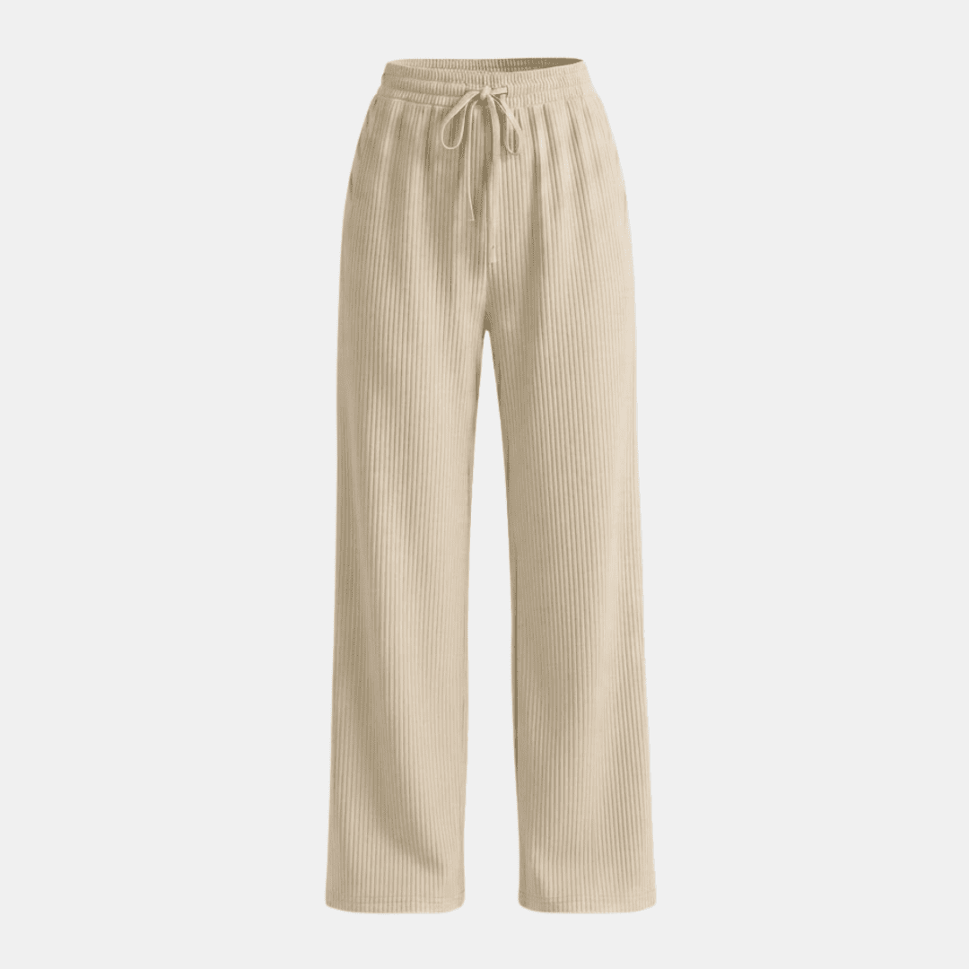 Women's plissé wide-leg trousers by Tammy Bradley, featuring flowing fabric and high waist, designed for a stylish, comfortable fit.