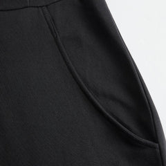 Black striped sleeveless hooded jumpsuit for women, featuring a relaxed fit and stylish design, perfect for casual wear.