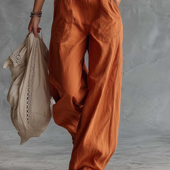 Rust orange cotton Western V-neck sleeveless jumpsuit for women, stylish and comfortable pants with a modern fit.