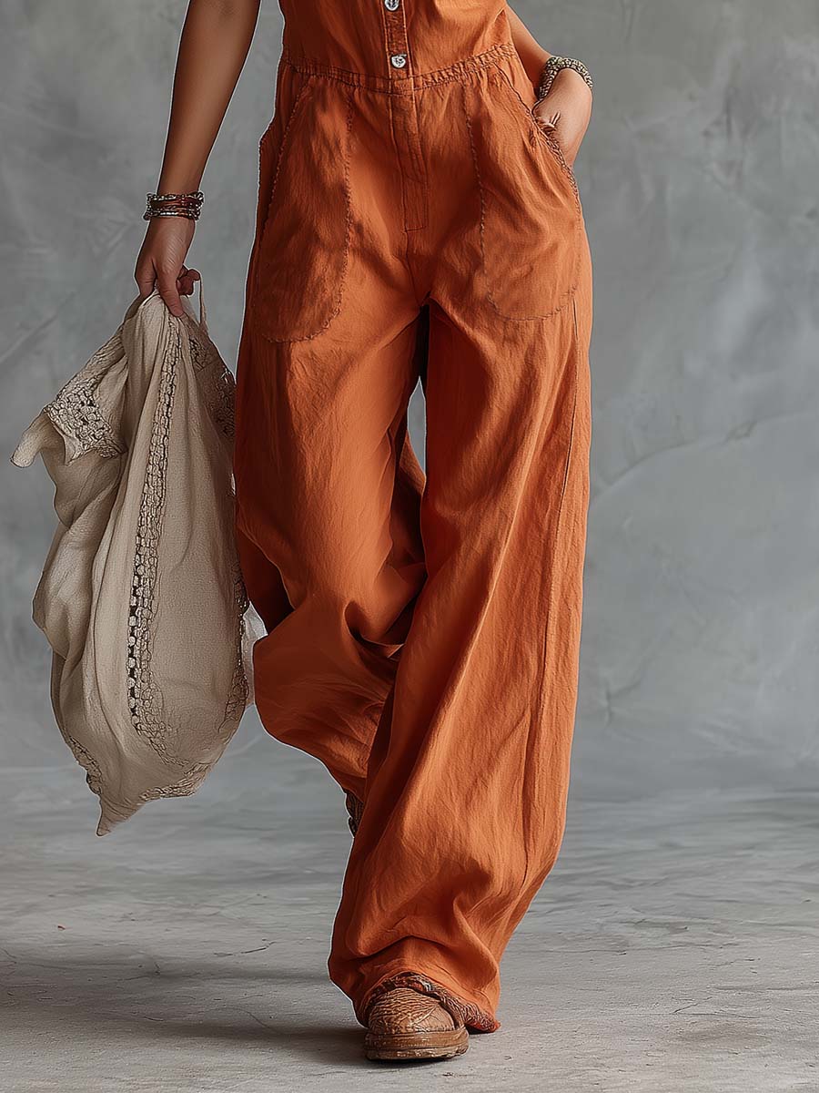 Rust orange cotton Western V-neck sleeveless jumpsuit for women, stylish and comfortable pants with a modern fit.