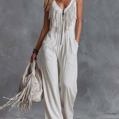 White faux suede western fringe V-neck jumpsuit for women, featuring stylish fringe details and a V-neck design.