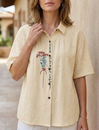 Apricot floral summer blouse for women, short sleeve denim top with a feminine fit, perfect for warm weather casual wear.