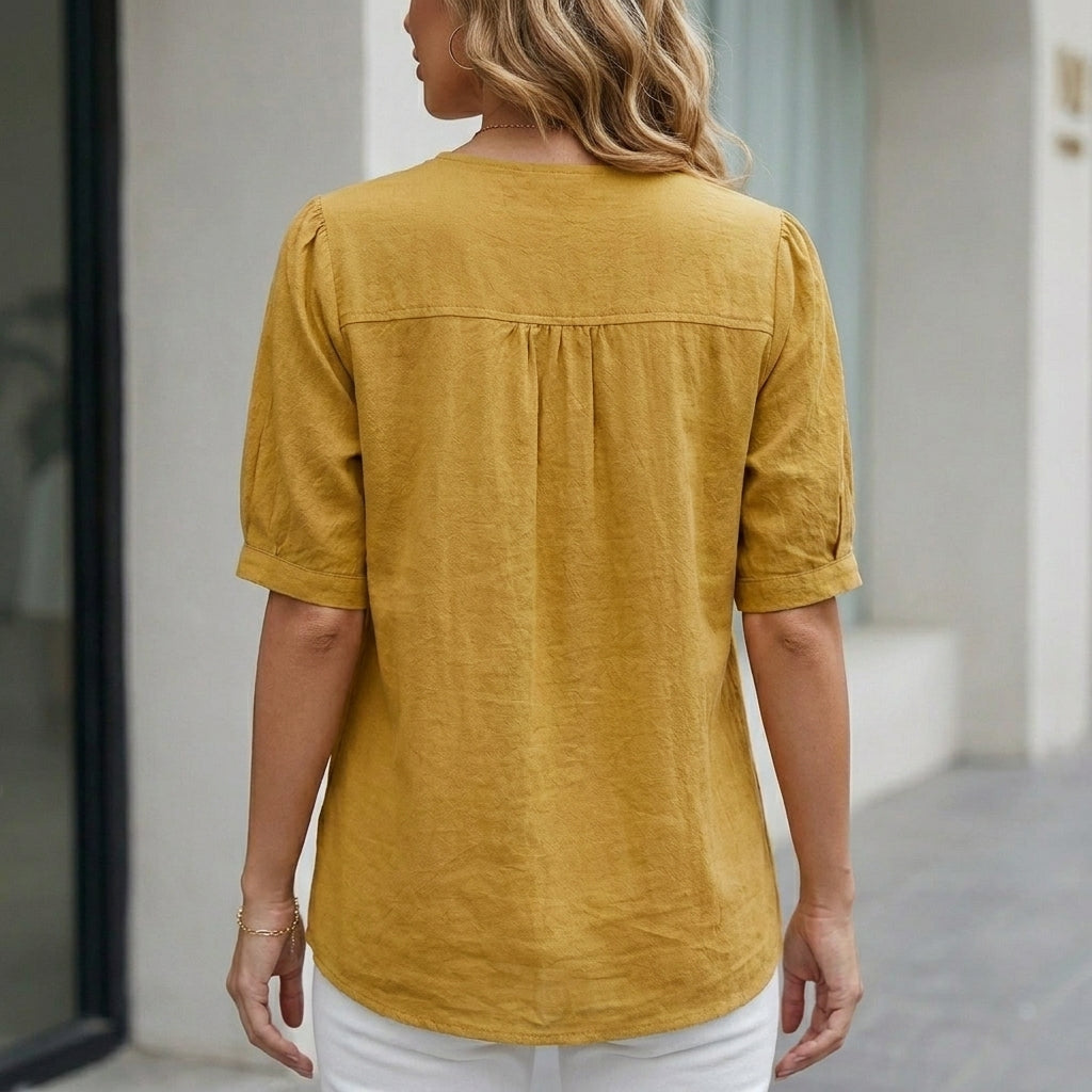 Back view of a women's summer blouse by My Store, short sleeve linen top with front pockets, casual and breathable fabric.
