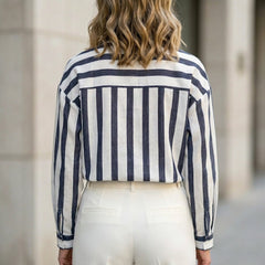 Back view of a women's summer blouse by My Store with white and navy striped long sleeves and a relaxed fit.
