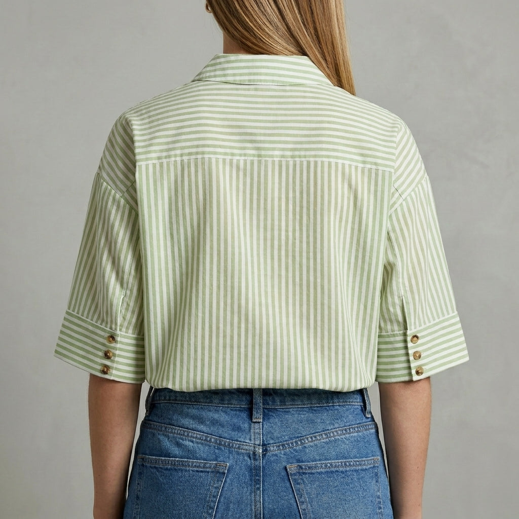 Back view of a women's striped linen summer blouse featuring a relaxed fit and short sleeves, perfect for warm weather.