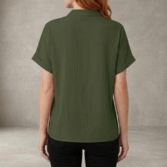 Back view of a women's summer denim blouse with V-neck and ruffle details, casual style perfect for warm weather.