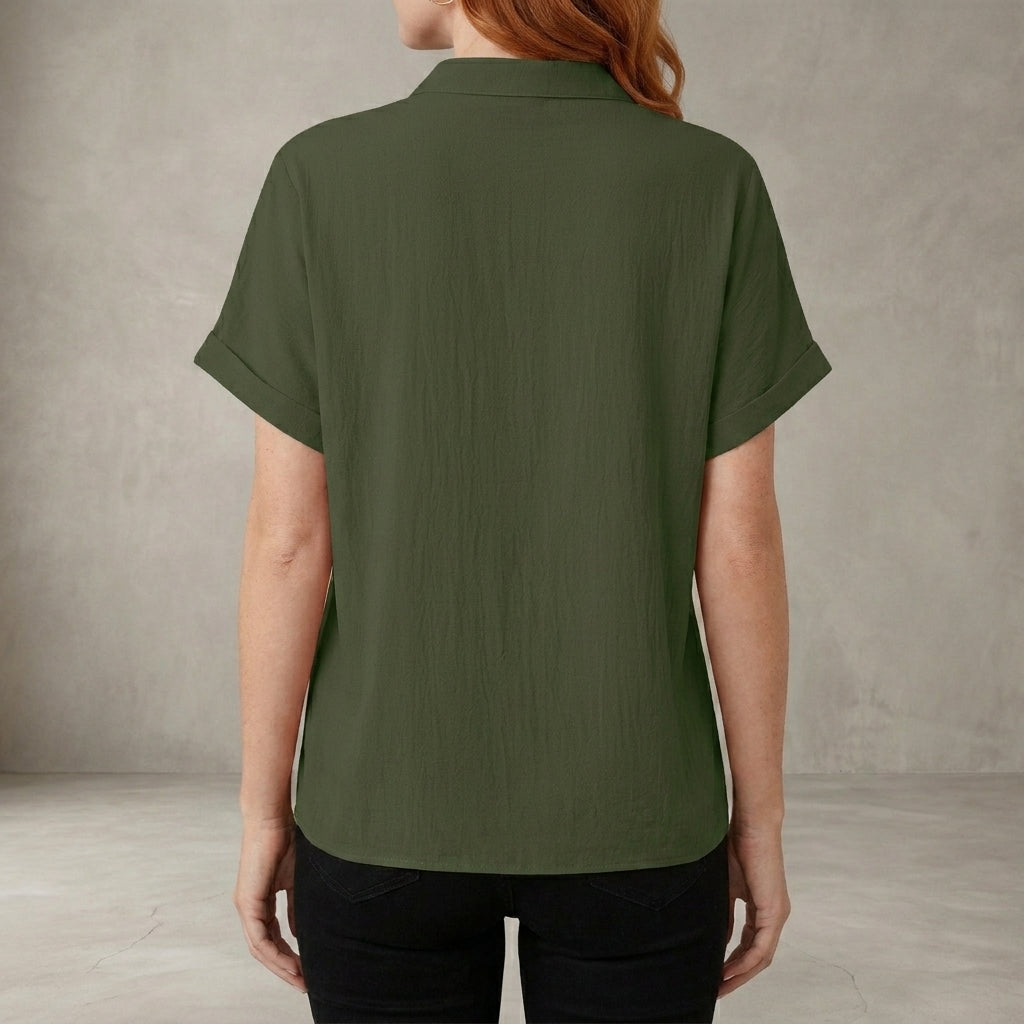 Back view of a women's summer denim blouse with V-neck and ruffle details, casual style perfect for warm weather.