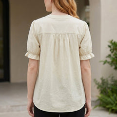 Back view of a denim summer blouse for women with puff sleeves and button front detail, stylish and casual top.