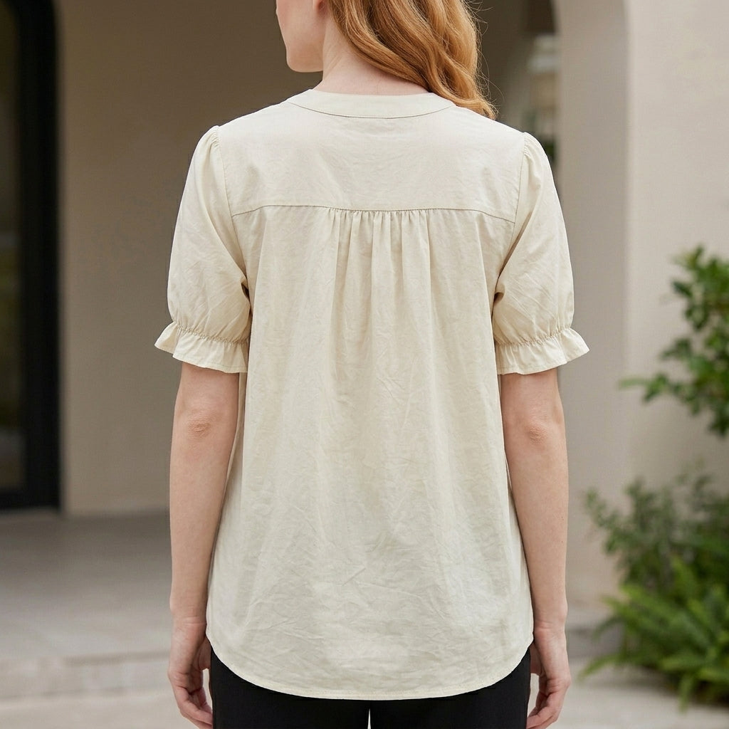Back view of a denim summer blouse for women with puff sleeves and button front detail, stylish and casual top.