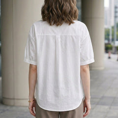 Back view of a women's summer denim blouse with puff sleeves, button front, casual style by My Store.