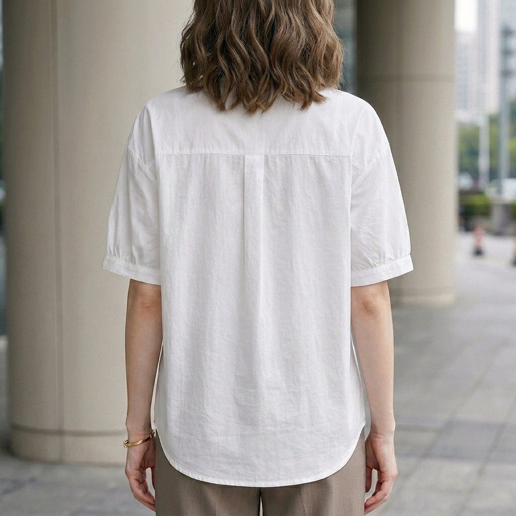Back view of a women's summer denim blouse with puff sleeves, button front, casual style by My Store.