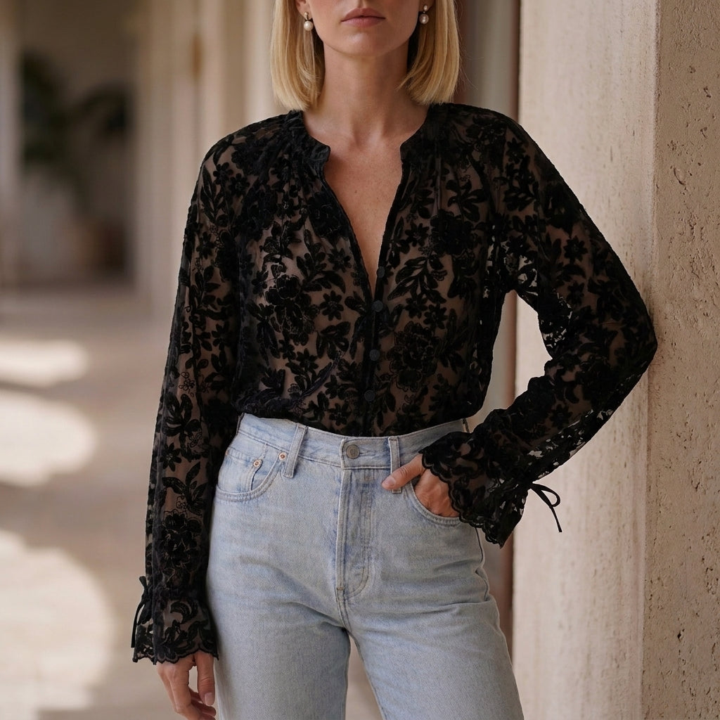Black women's summer blouse with floral print, V-neck, and lace details, perfect for warm-weather casual wear.