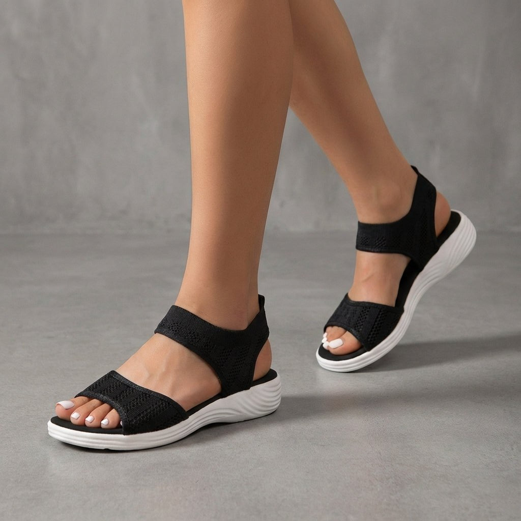 Black knit ankle-strap sandals for women by Tammy Bradley, featuring open toes and stylish ankle straps.