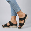 Black floral strap wedge heeled sandals for women by Tammy Bradley, featuring a stylish design and comfortable heel height.