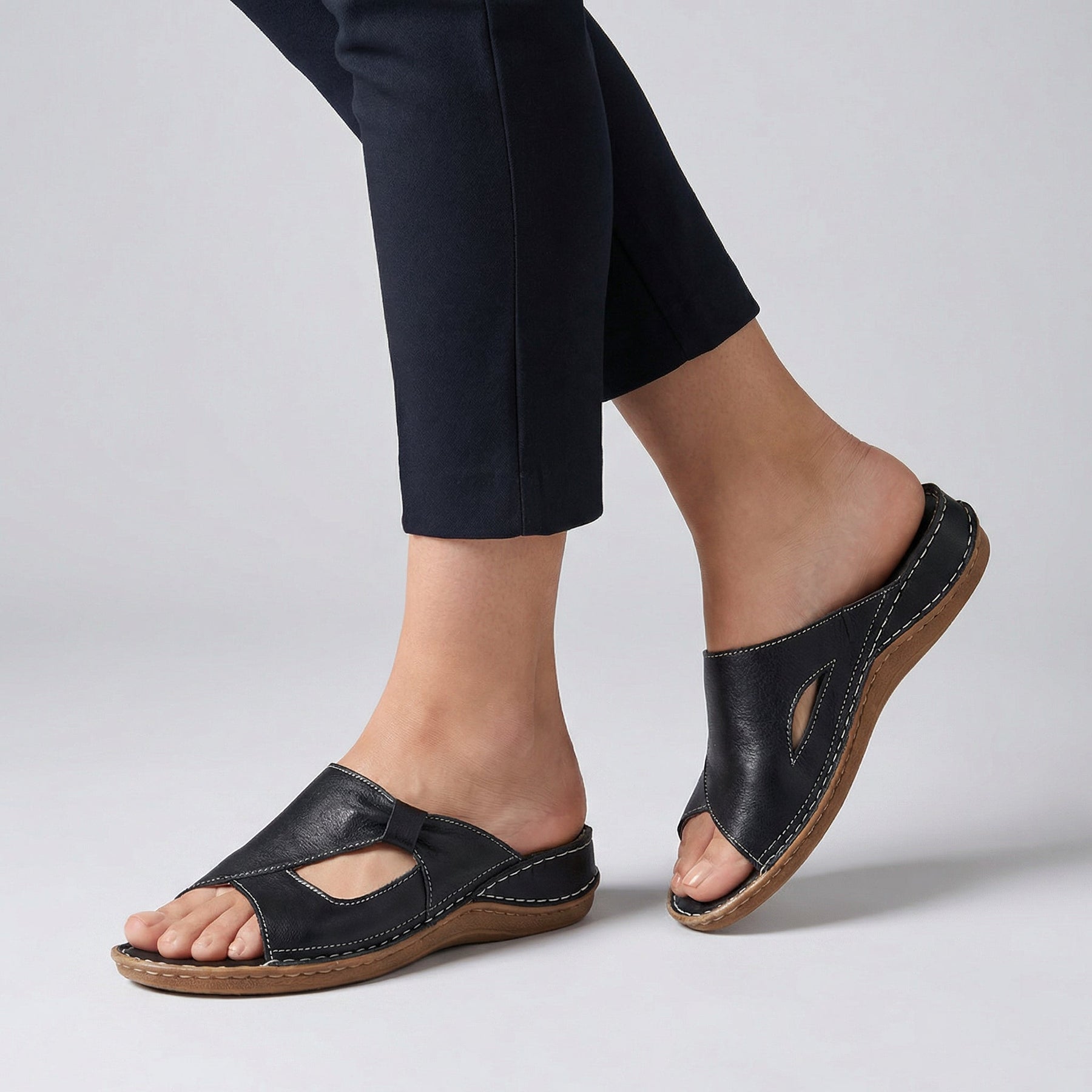 Black open-toe slide sandals for women by Tammy Bradley, featuring a comfortable slip-on design and stylish open-toe style.