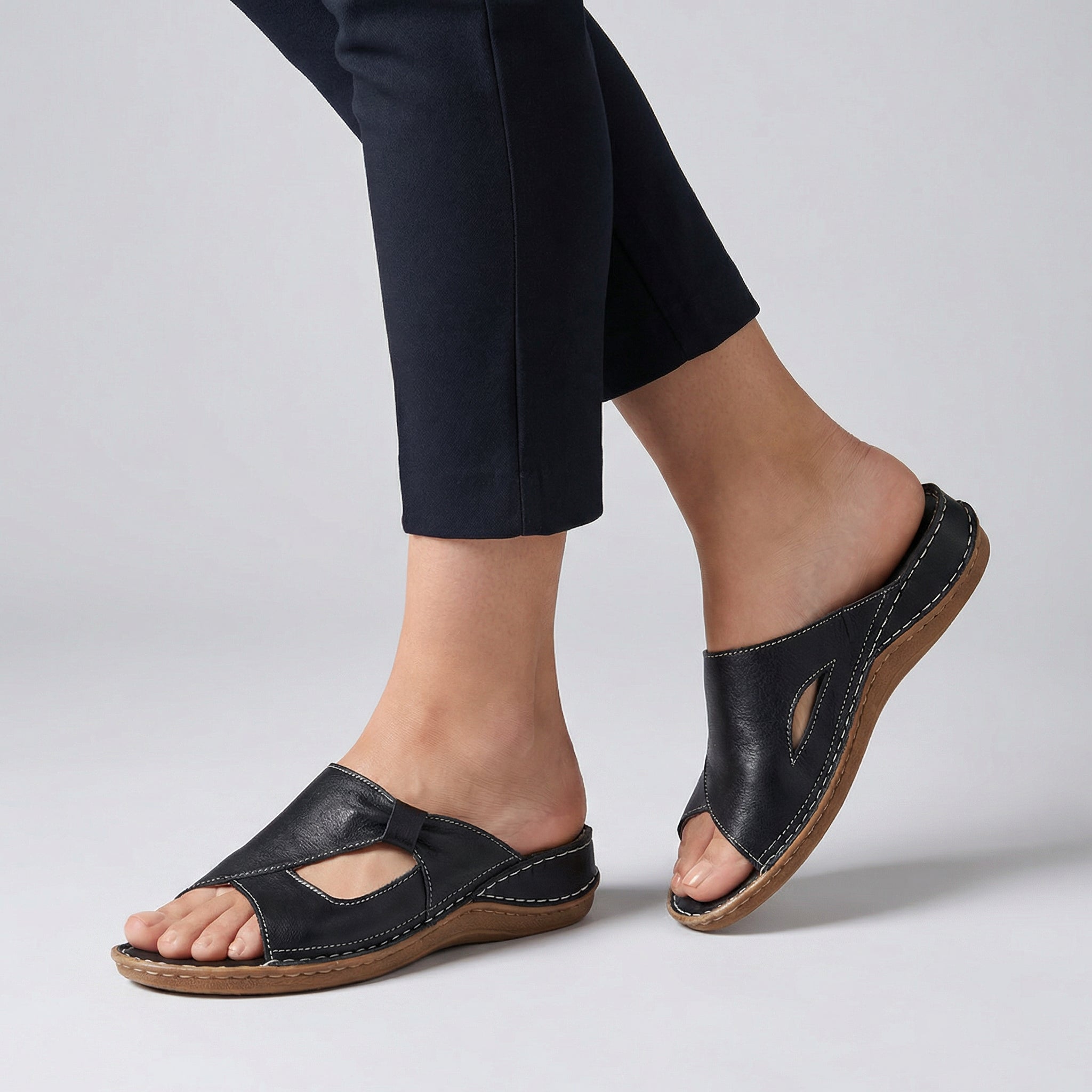 Black open-toe slide sandals for women by Tammy Bradley, featuring a comfortable slip-on design and stylish open-toe style.