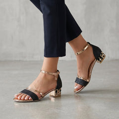 Black metallic block-heel ankle-strap sandals for women by Tammy Bradley, featuring stylish design and secure strap closure.