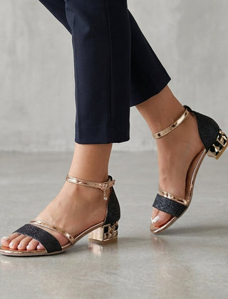 Black metallic block-heel ankle-strap sandals for women by Tammy Bradley, featuring stylish design and secure strap closure.
