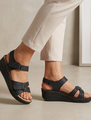 Black open-toe wedge-heel sandals for women by Tammy Bradley, showcasing stylish design and comfortable footwear.