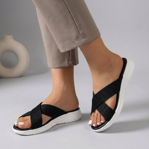 Black Tammy Bradley criss-cross knit slide sandals for women, stylish and comfortable slip-on shoes with open toes.