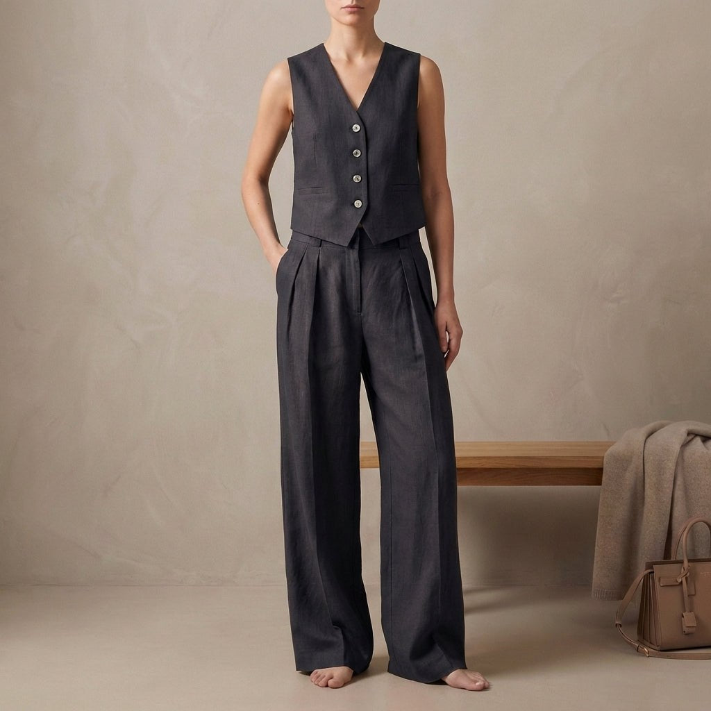 Black women's linen pleated two-piece co-ord set by Tammy Bradley, featuring a stylish top and matching skirt.