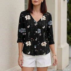 Black women's summer blouse with floral pattern, V-neck, denim fabric, and button front, perfect for casual warm-weather wear.